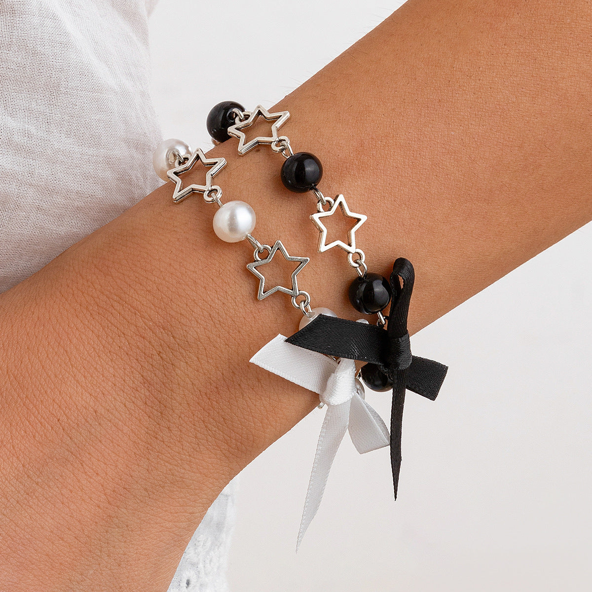 Set Bracciali Farfalla e Perle