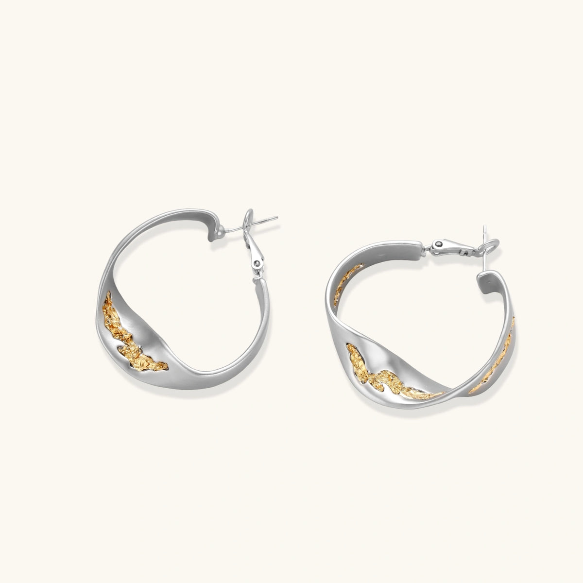 Silver hoop earrings with organic gold flowing accents, featuring eco-zinc alloy construction and secure posts.