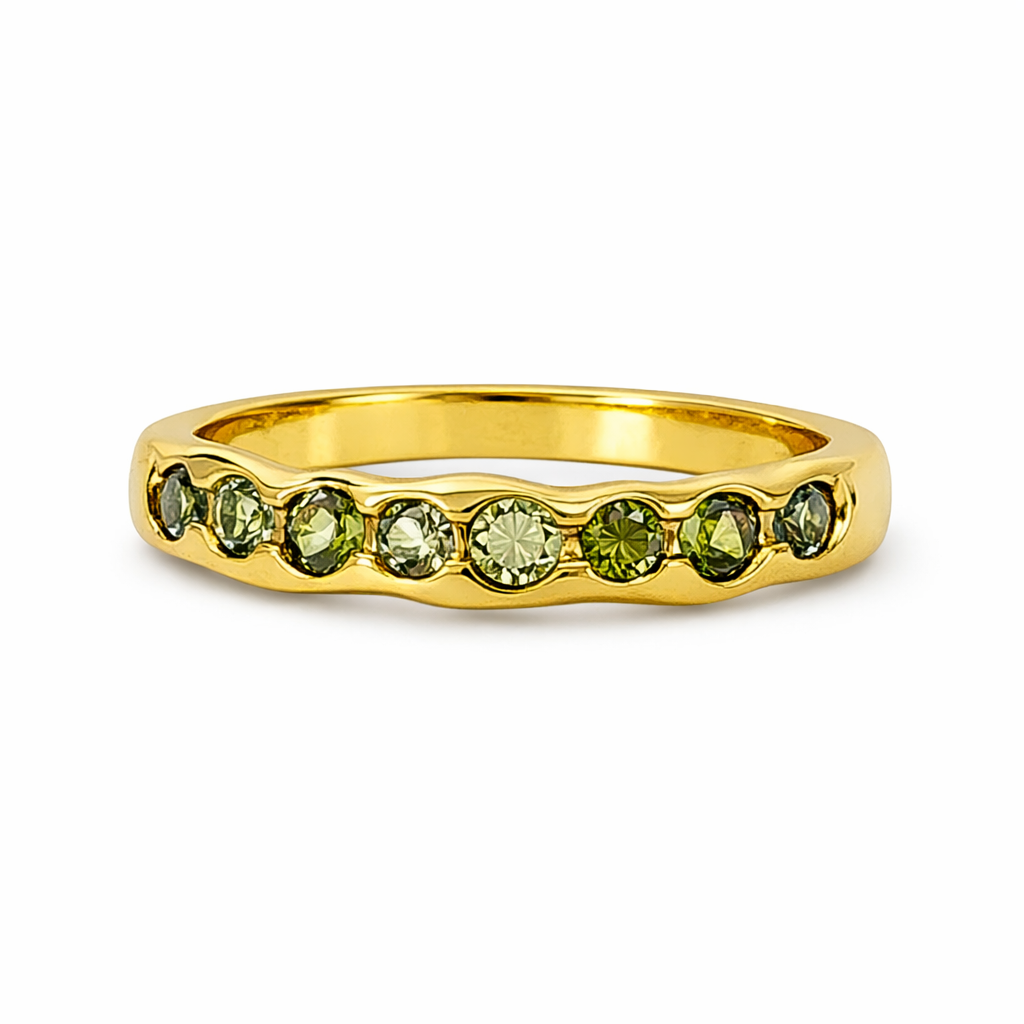 Un lampo di verde. Un tocco d'oro. Una donna che non passa inosservata
